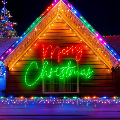 Wooden cabin with 'Merry Christmas' lights and colorful string lights on a dark night.